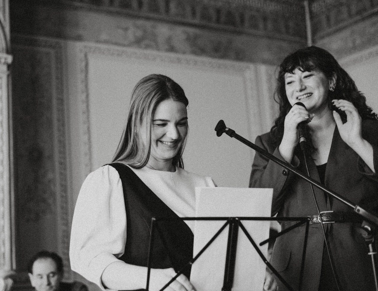 Yana Litinskaya performing on stage with another singer